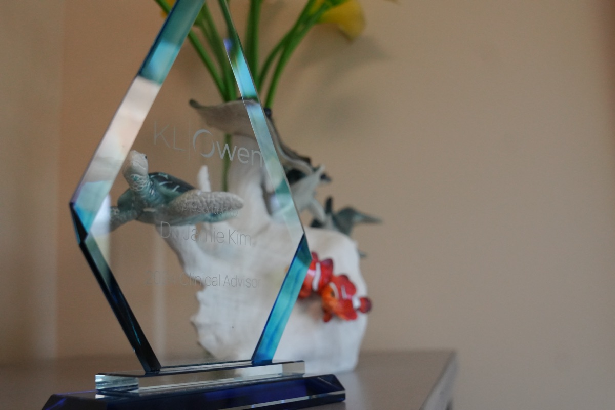 Dr. Jamie Kim receiving the KLOwen Key Opinion Leader award at iCare Orthodontics in Norcross, GA